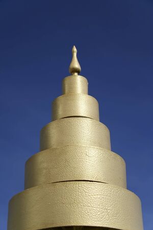 close-up of buddhist temple decoration against vivid blue sky in thailandの写真素材