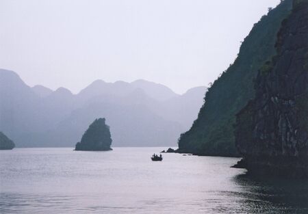 small fishing boat in halong bay vietnamの写真素材