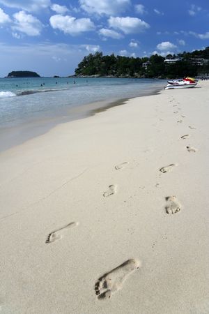 jetski and footprints on kata noi beach on phuket island, thailandの写真素材