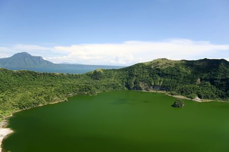 taal crater lake seen from the slopes of the highly active taal volcano tagaytay in the philippinesの写真素材