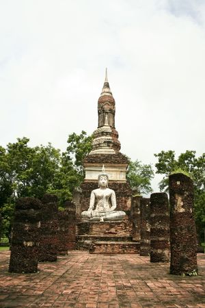 seated buddha among the ruins of the ancient capital of thailand in sukothai historical parkの写真素材