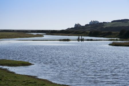 river flowing through the seven sisters national park in east sussex brighton englandの写真素材