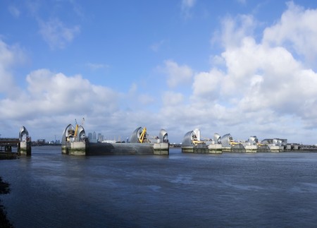 Londons thames barrier flood defenses crossing the river near greenwichの写真素材