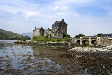 eilean donan castle dating from the 13th century, built on a small island in Loch Duich in the highlands of scotland and connected to the mainland by a stone bridgeの写真素材