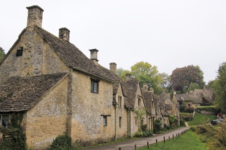 Row of traditional cottages built of golden limestone in Bilbury Village, The Cotswalds, Gloucestershire, Englandのeditorial素材