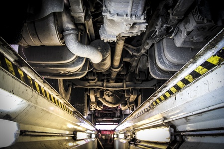 underneath of a truck as seen from vehicle inspection trench の写真素材