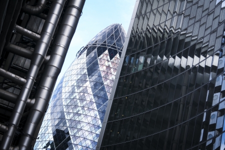 perspective view of street in the city of london financial district with striking modern architecture of the gherkin lloyds and willis buildingsのeditorial素材