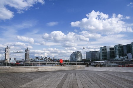bankside river thames in london england with the skyline of the tower bridge and town hallの写真素材