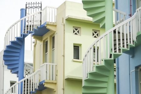colorful spiral staircases at the back of traditional chinese shop houses in singapore cityの写真素材