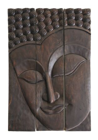carved buddhas face on three dark wodd panels on a white backgroundの写真素材