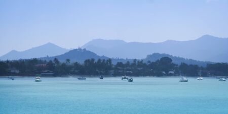 panoramic view of koh samui island coastline at dawn with hilltop temple in chaweng behindの写真素材