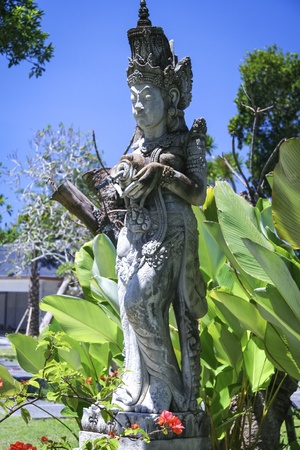 traditional balinese style statue in temple gardens in sanur baliの写真素材