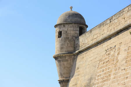 watch tower on palmas old city walls against clear blue sky in majorca spainの写真素材