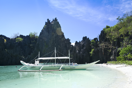 El Nido, Philippines - May 18, 2007: banka outrigger tour boat in hidden lagoon where tourists swim . El Nido is one of the top tourist destinations in the world.のeditorial素材
