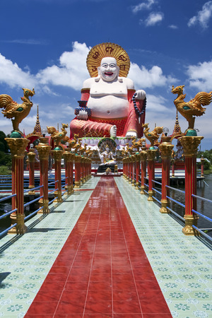 giant colorful buddha statue at wat plai laem temple on koh samui thailandの写真素材
