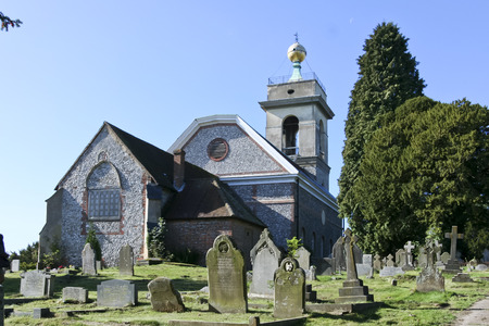 flint walled church on hilltop in west wycombe buckinghamshire ukのeditorial素材
