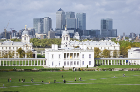 London, UK - Oct 25, 2009: The skyline of the Canary Wharf business district of London. The foreground features the Royal Naval College. Photo taken from the top of the hill at Greenwich park.のeditorial素材