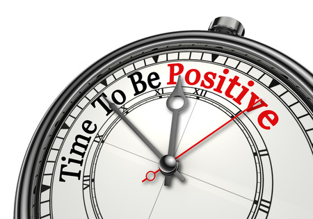 Time to be positive red word on concept clock, isolated on white backgroundの写真素材