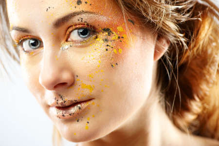 Closeup portrait of beautiful young woman with glamour makeup