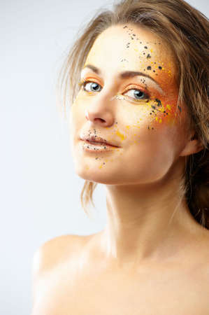 Portrait of beautiful young woman with glamour makeup