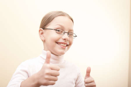 Attractive portrait of cute little girl in glassesの写真素材