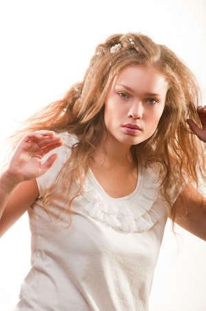 Bright fashion portrait of beautiful young woman on whiteの写真素材