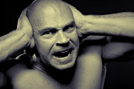 Emotional portrait of muscular aggressive manの写真素材