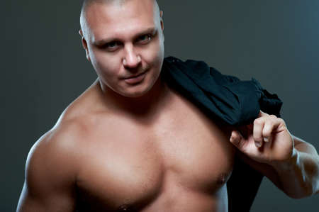 Handsome sexy young guy, studio shotの写真素材