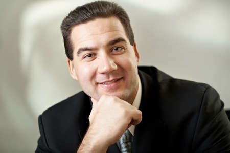 Portrait of attractive businessman in blacksuit