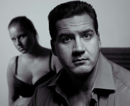 Young couple having relationship problems, in bedroomの写真素材