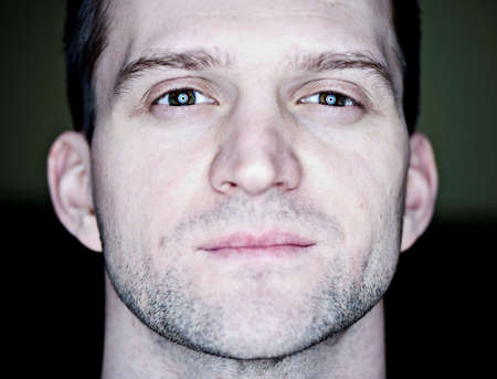 Closeup portrait of a serious guy, shallow DOFの写真素材