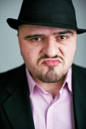 Attractive unshaved man in black hatの写真素材