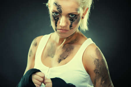 Attractive blonde fighter girl, studio shot, cross processedの写真素材