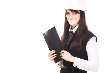 Beautiful young business woman in hard hat isolated on whiteの写真素材