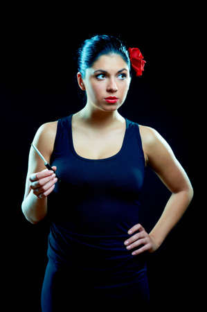 Sexy chiquita with cigarette and red roseの写真素材