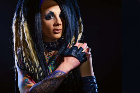 Beautiful demon girl with black eyes, studio shot