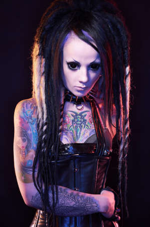 Beautiful demon girl with black eyes, studio shot