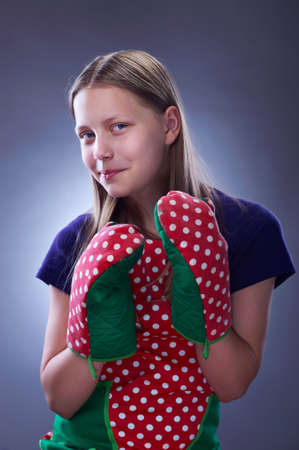 Portrait of a little cute housewife, studio shotの写真素材
