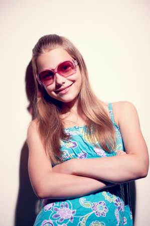 Contrasty portrait of a teen girl with sunglassesの写真素材