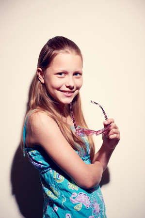 Contrasty portrait of a teen girl with sunglassesの写真素材