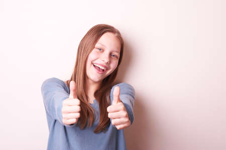 Portrait of a cute smiling teen girlの写真素材