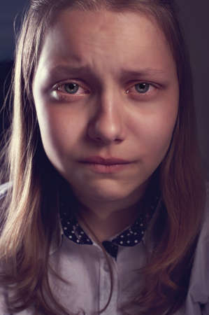 Portrait of a depressed teen girl, studio shotの写真素材