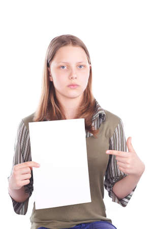 Sad teen girl with blank card, studio shotの写真素材