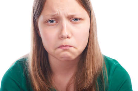 teen girl making funny faces on white background isolated on white, studioshot