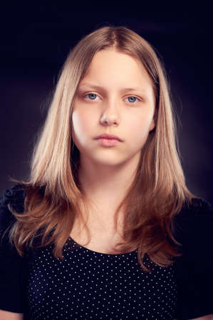 Sad teen girl, studio shot