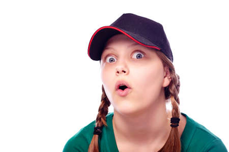 Beatiful shocked teen girl in cap