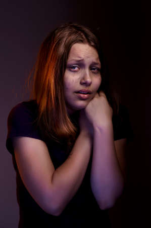 Afraided teen girl experiences fearの写真素材