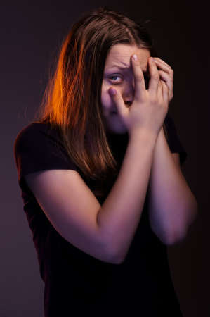 Afraided teen girl experiences fearの写真素材