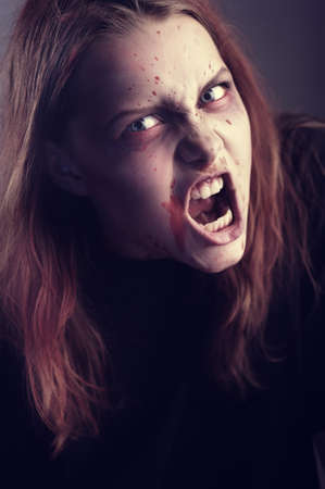 Mad possessed by a demon girl shoutingの写真素材