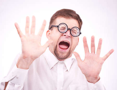 Portrait of an afraid man in glassesの写真素材